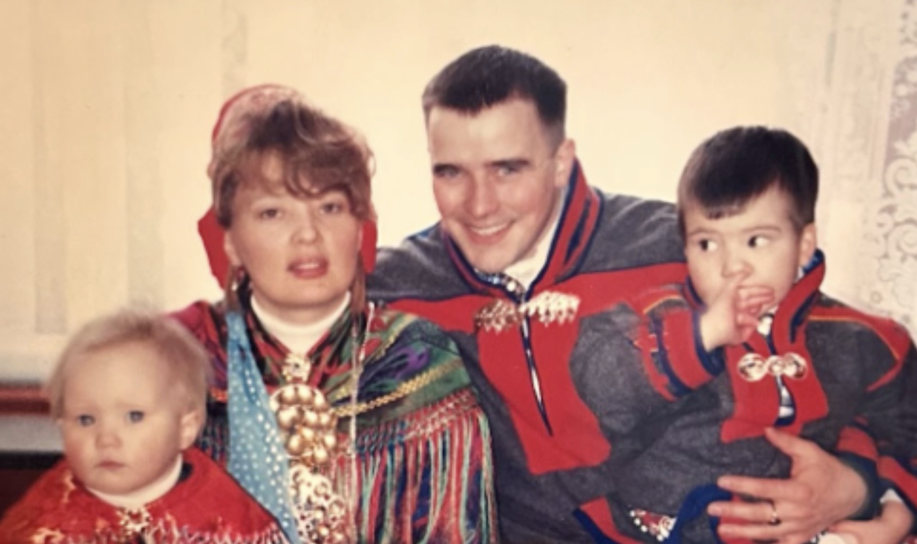 A family of four pose for a picture dressed in traditional clothing from the Sami people of northern Scandinavia